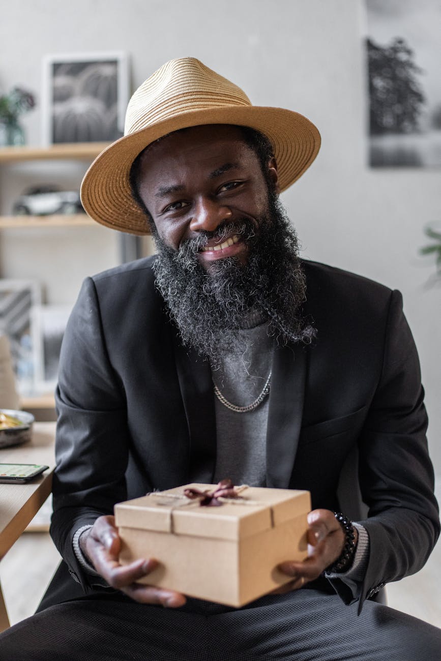 smiling black man with gift box